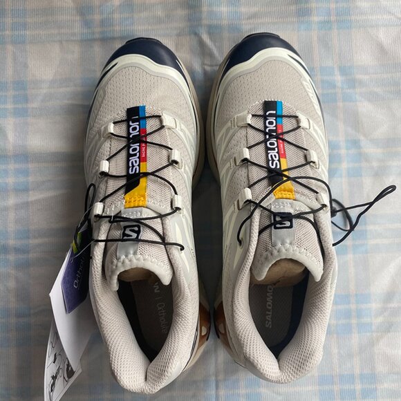 Salomon Sneakers Are Light Gray With Black Laces. - Picture 3 of 9